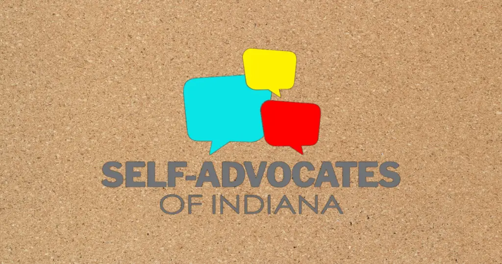 SAI logo over bulletin board